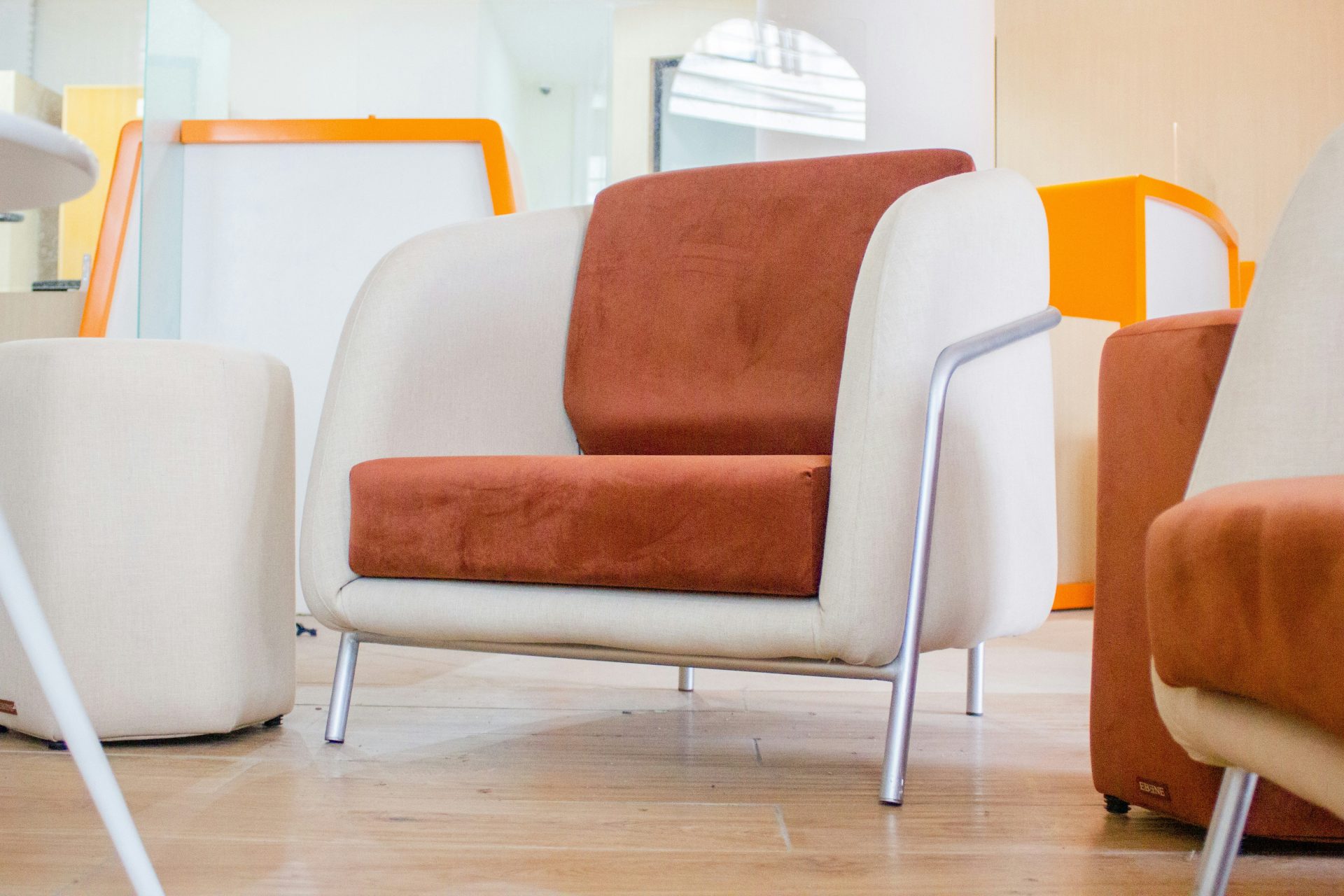 a couple of chairs sitting on top of a hard wood floor